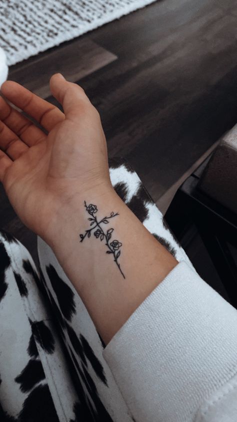 Small Cross And Flower Tattoo, Womens Cross Tattoo With Flowers, Cross Of Flowers Tattoo, Flower With Faith Stem Tattoo, Small Cross Flower Tattoo, Cross W Flowers Tattoo, Crosses With Flowers Tattoo, Cross On Ribs Tattoo For Women, Cross Side Tattoo