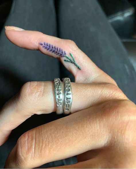 Lavender flower tattoo on the finger. Colour Finger Tattoo, Flower Finger Tattoo, Lavender Flower Tattoo, Flower Finger Tattoos, Ring Tattoo Designs, Thumb Tattoos, Ring Tattoos, Finger Tattoo, Coloured Hair