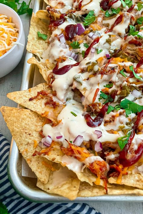 Easy Sheet Pan BBQ Chicken Nachos | Modernmealmakeover.com Best Dinner For A Crowd, Sheet Pan Chicken Nachos Recipe, Fun Friday Night Dinners, Nacho Night Ideas, Dinner For Guests Friends Easy Recipes, Smothered Nachos, Game Day Nachos, Easy Hosting Meals, Gameday Dinner