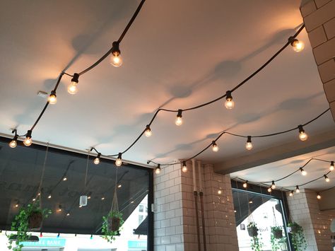 Coffee Shop String Lights, Backyard Patio Floor Ideas, Patio Kitchen Ideas Outdoor, Backyard Patio Designs Budget, Patio Ideas Design, Patio Kitchen Ideas, String Lights Living Room, Patio Floor Ideas, Patio Planting