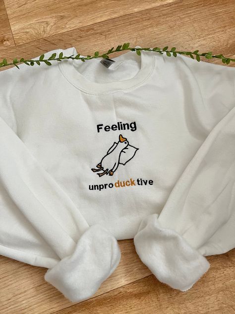 Feeling unproductive embroidered duck sweatshirt! All sweatshirts are made within 1-3 weeks. How to order: 1. Select your size 2. Select the colour you would like for your sweatshirt 3. Add to basket and place order Sweatshirt: 50% cotton/50% polyester Unisex design, great for everyone! Colour - Optional (if a colour is out of stock I will message you to notify you) Fit - True to size (if you would like to order a different size that is not listed please message me) Duck Sweatshirt, Embroidered Duck, Funny Duck, Funny Sweatshirts, Embroidered Sweatshirts, Unisex Design, Embroidered Patches, Outfit Inspirationen, New Outfits