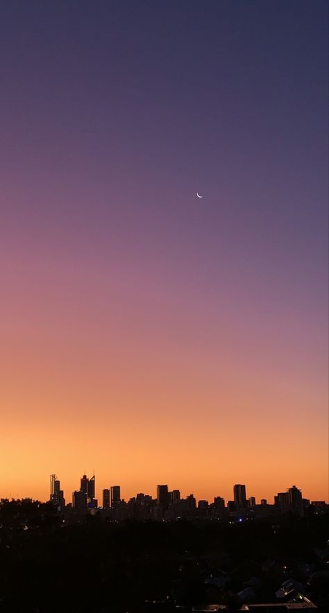 City scape with sunset going from blue, purple, pink, orange, yellow gradient. Moon in right hand corner. Nature, Light Sunrise Aesthetic, City Sunset Aesthetic, City Sunset, God's Glory, City Of God, Beautiful Flowers Photography, Sky Wallpaper, Sunset City