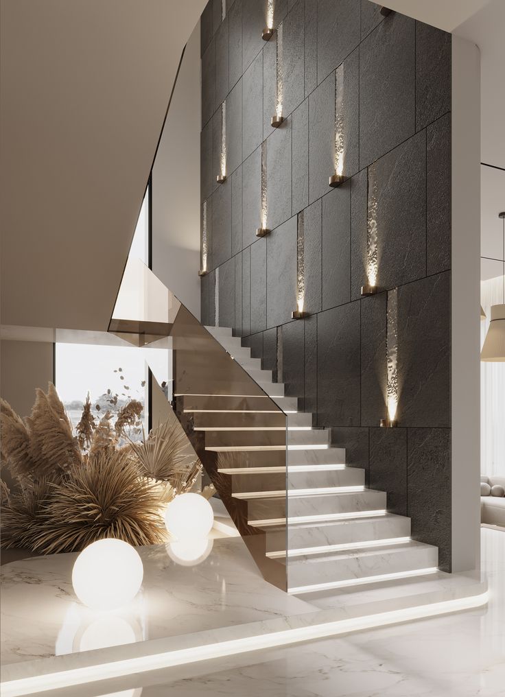 an elegant staircase with modern lighting in the background