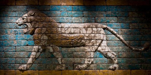 a brick wall with a painted lion on it