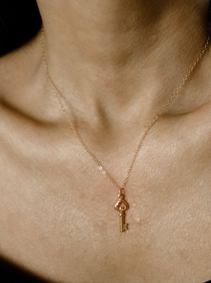 Meet Carolina, your next jewelry obsession. Its vintage key pendant is perfect for layering or wearing it by itself. MATERIALS & SIZE Material: 18k gold filled chain and 18k gold plated pedant Size: 16 in. chain Extender: 2 in. JEWELRY CARE Most of our jewelry is tarnish resistant, hypoallergenic, safe for sensitive skin. Handmade with ♡ in New York. - To maintain the beauty of your jewelry, whether it’s stainless steel, gold plated, or gold-filled, always avoid saltwater, chlorine (swimming poo Vintage Key Necklace, Gold Necklace Vintage, Key Necklace Vintage, Vintage Key, Vintage Keys, Chain Extenders, Key Necklace, Key Pendant, Necklace Vintage