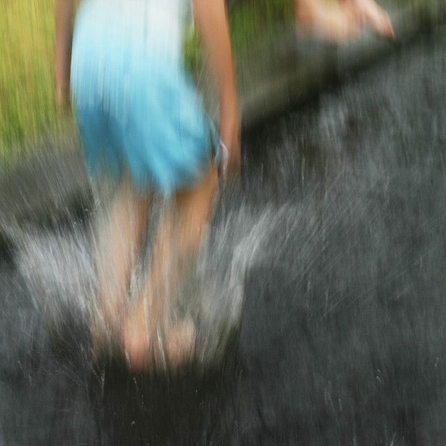 blurry image of two people walking in the rain