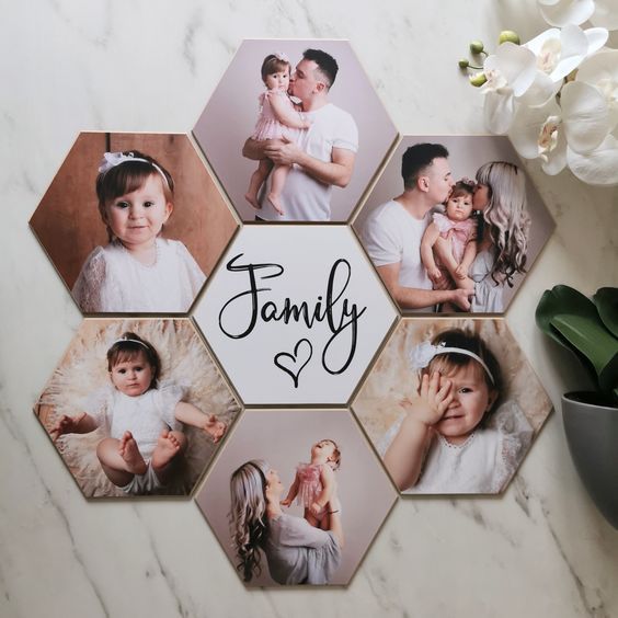 a family photo collage on a marble table with white flowers in the foreground