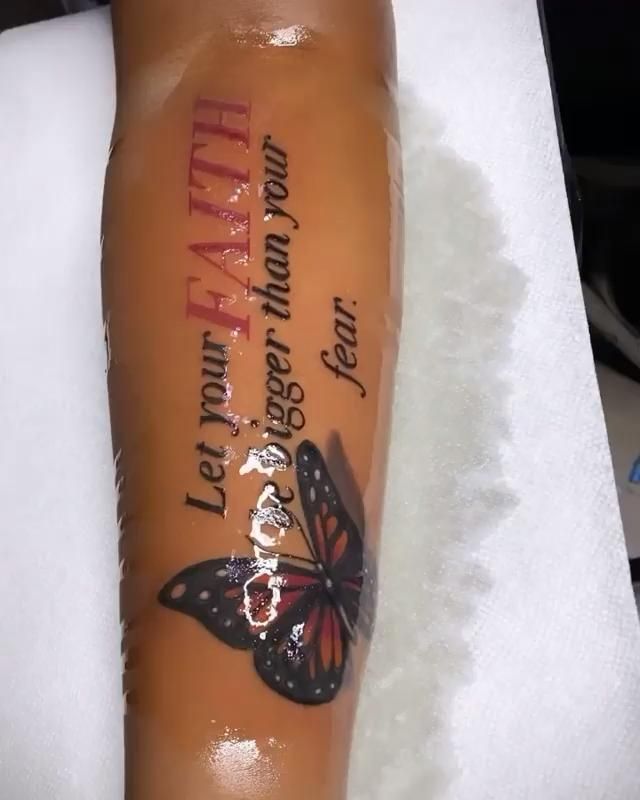 a tattoo with a butterfly on it