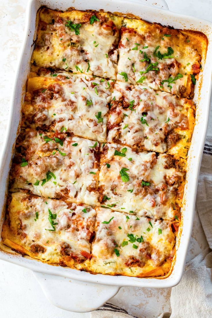 a casserole dish filled with meat and cheese