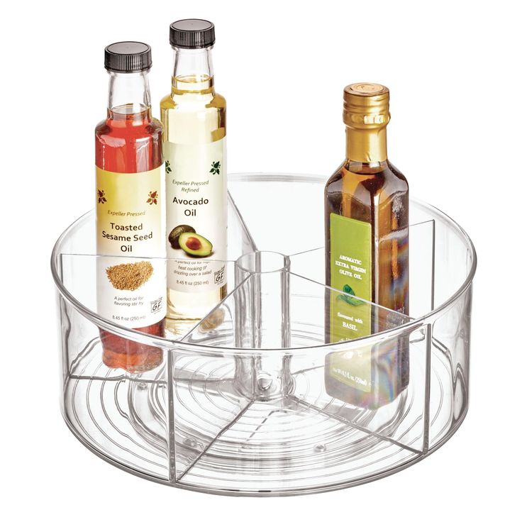 three bottles are sitting in a clear holder