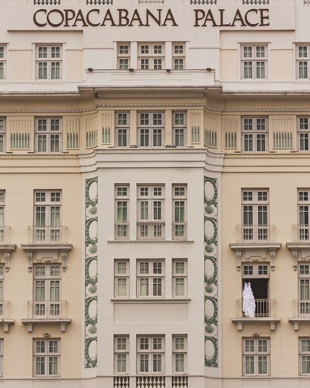 an old building with balconies on the windows