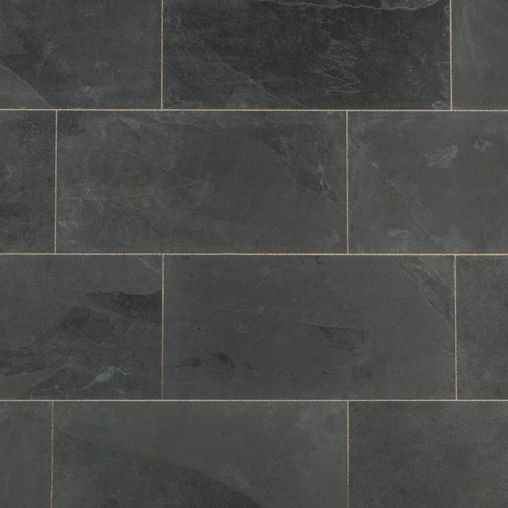 a black slate tile floor with grey veining