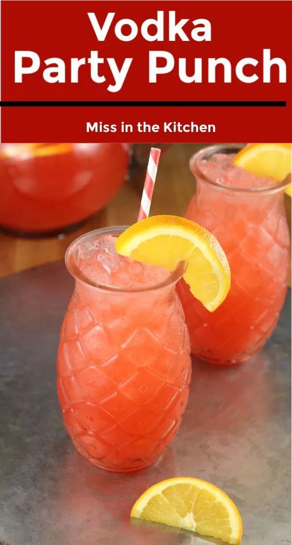 two glasses filled with vodka and lemonade on top of a table