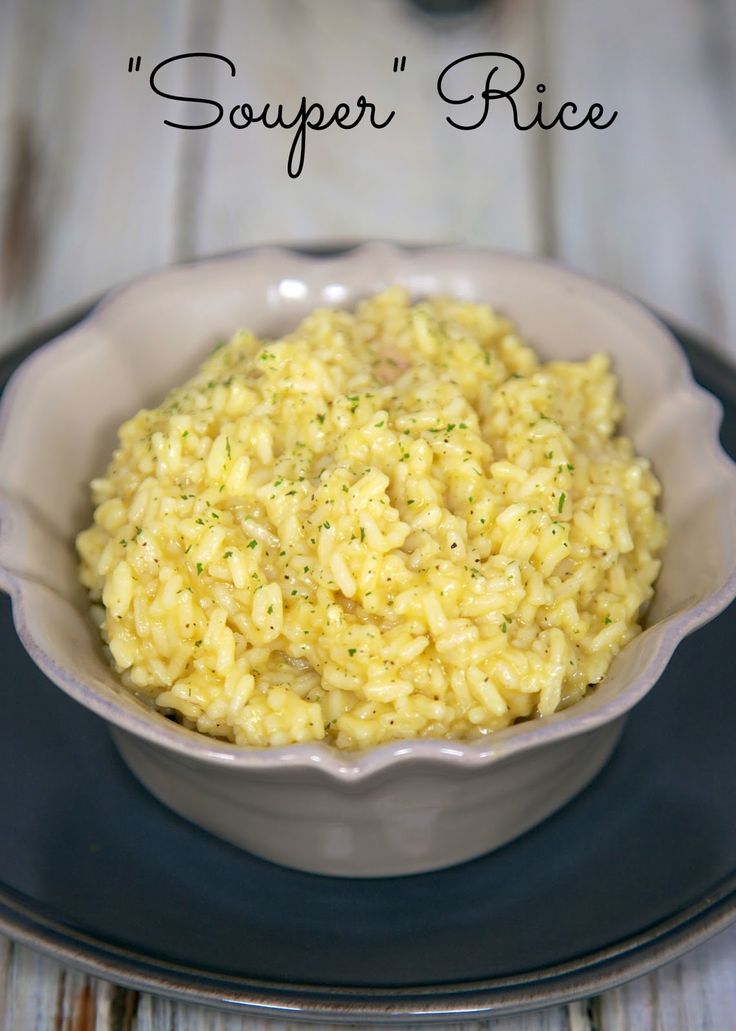 a white bowl filled with rice on top of a plate