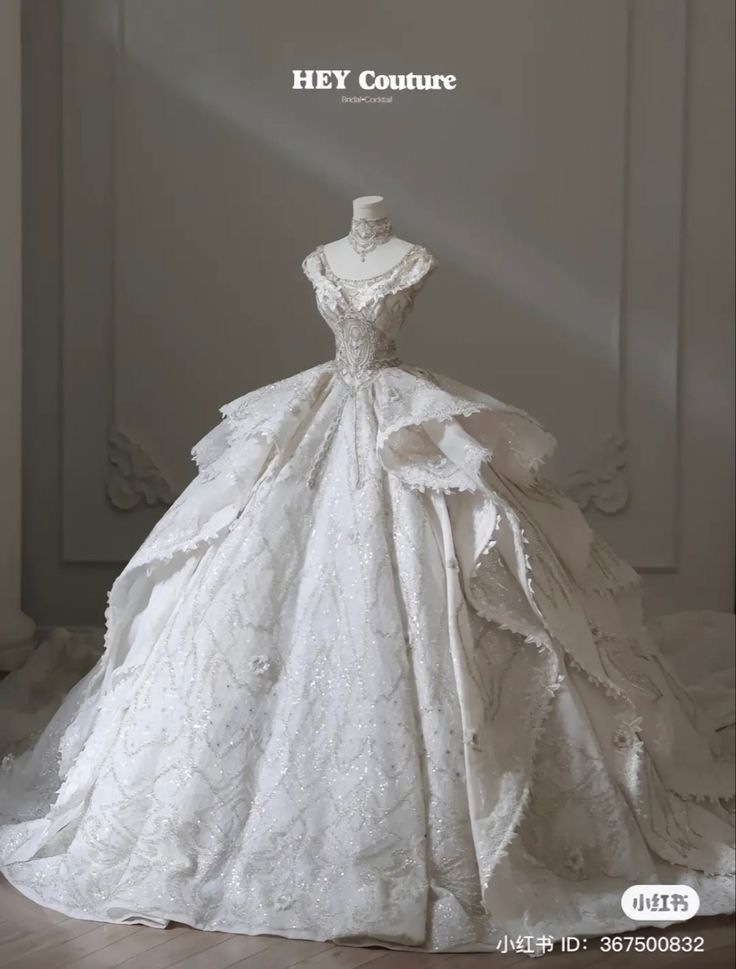 a white wedding dress on display with the words hey couture written above it