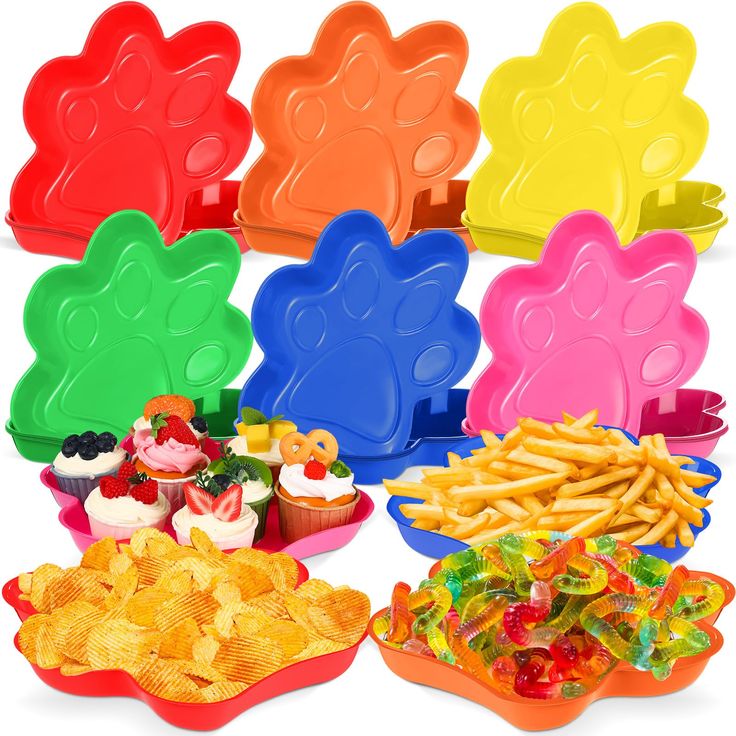 colorful plastic food trays filled with different types of snacks and desserts next to each other