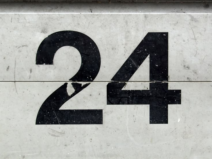 the number twenty four is written in black