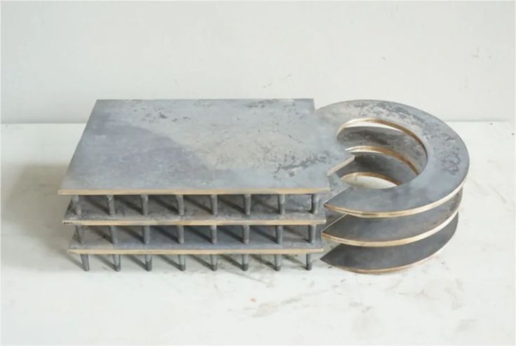 several pieces of metal are stacked on top of each other