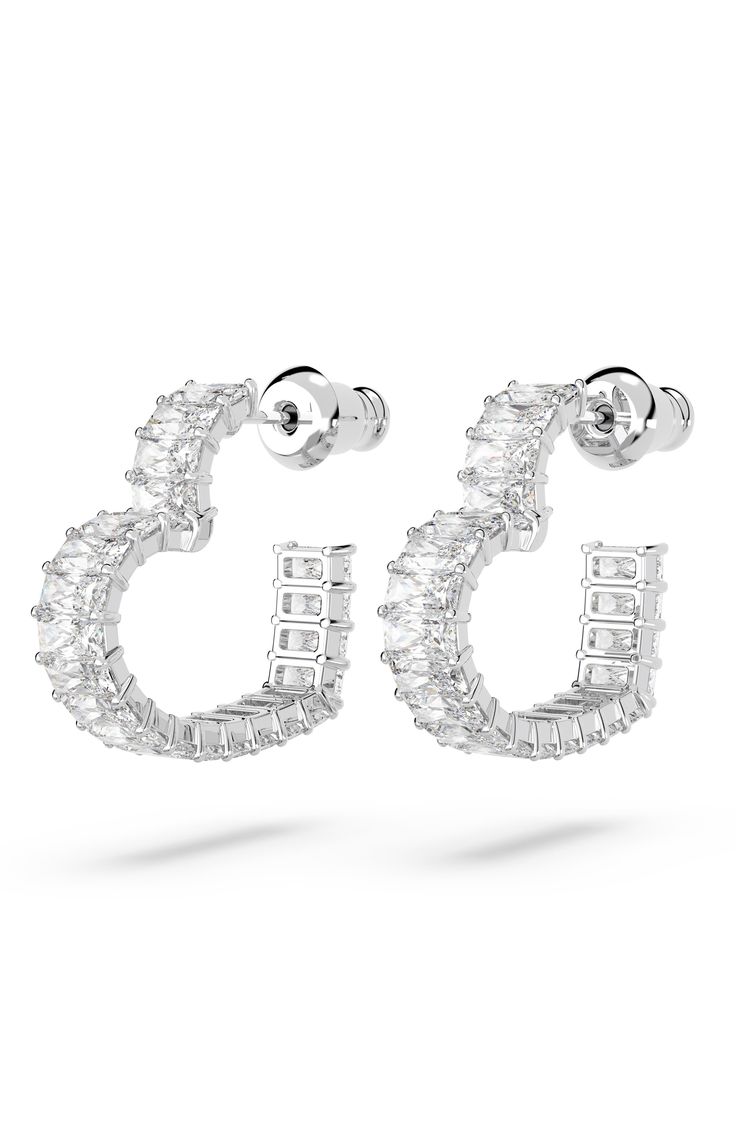 Baguette-cut pavé crystals trace these heart-shaped earrings in signature Swarovski shine and will add a romantic glow to any look, day or night. 5/8" drop; 1/8" width Post back Rhodium plate/Swarovski crystal Imported Baguette, Heart Shaped Diamond Earrings, Swarovski Heart Earrings, Diamond Heart Earrings, Glitter Accessories, Swarovski Jewelry Earrings, Small Silver Hoop Earrings, Shaped Hoop Earrings, Diamond Pendants Designs