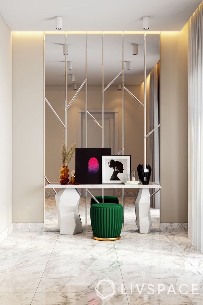 an office with marble floors and walls, including a white desk surrounded by two green vases