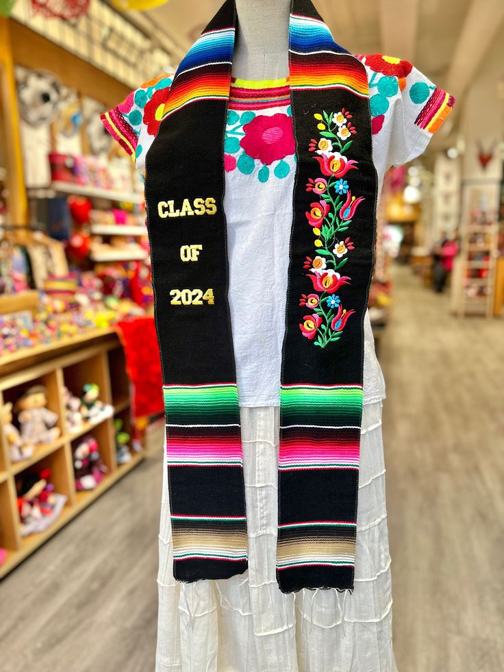 Celebrate your or a loved ones graduation with this Mexican graduation stole! This stole features the strong, radiant colors of Mexico's classic Sarape fabric, celebrating the class of 2024!Each stole features excellent quality Sarape, made in Tlaxcala, Mexico. Stole measures 6' 6" long and 5" wide Grad Stoles, Mexican Graduation, Graduation Boards, Graduation Stoles, Graduation Sash, Mexican Gifts, Graduation 2024, Graduation Stole, Mexican Outfit