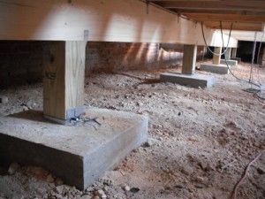 an unfinished room with concrete blocks and electrical wires