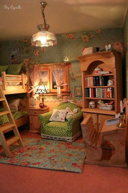 a dollhouse bedroom with bunk beds, desks and bookshelves in it