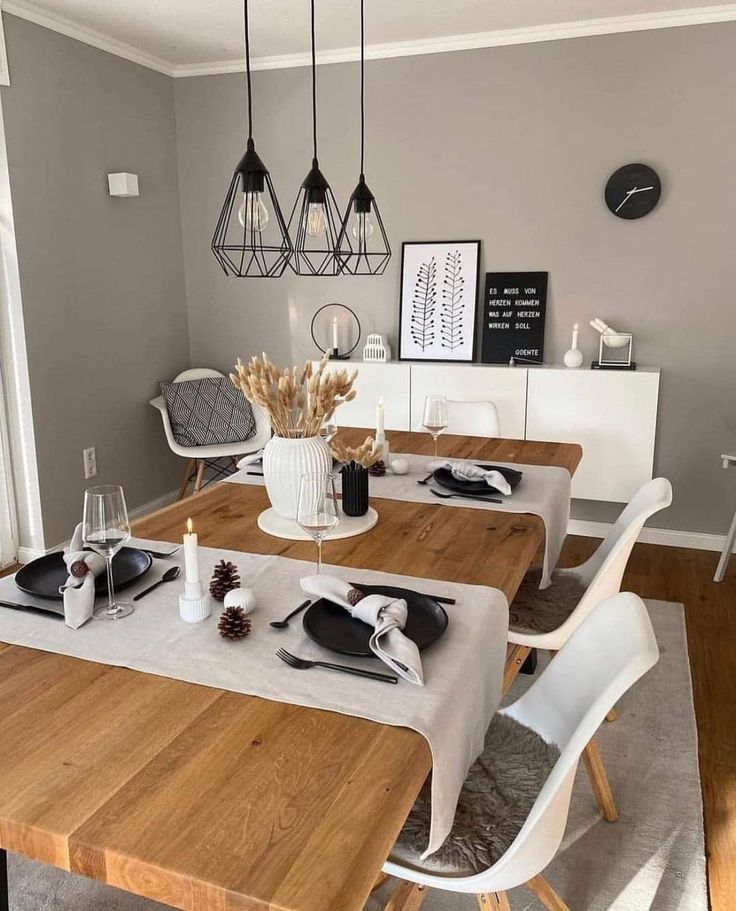 a dining room table is set with place settings