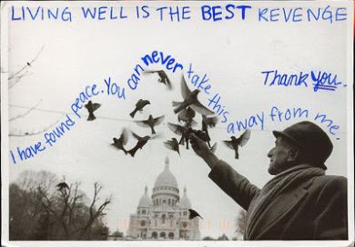 a man is feeding birds in front of the capitol building with words written on it