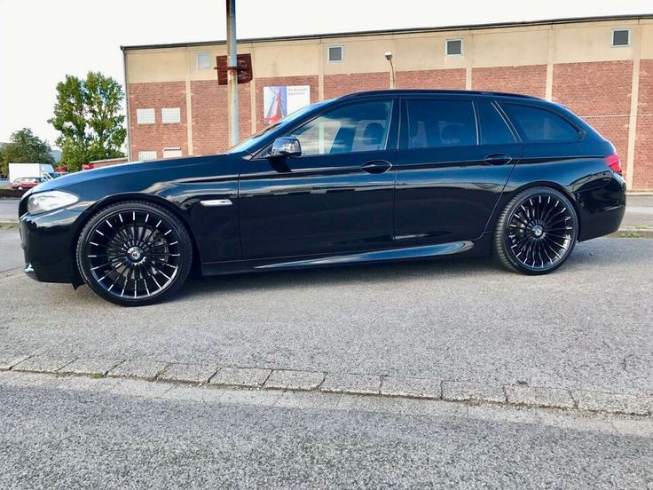 a black car parked in front of a building