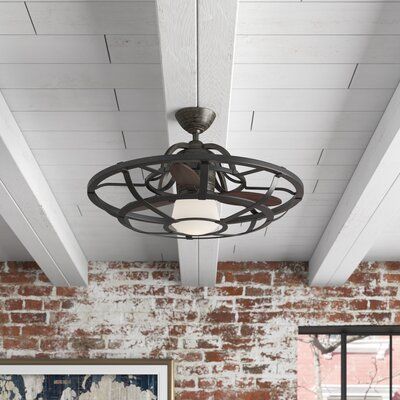 a living room with exposed brick walls and a ceiling fan