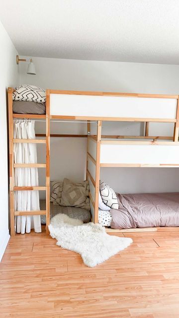 there is a bunk bed in the room with two beds on each side and a ladder to the top