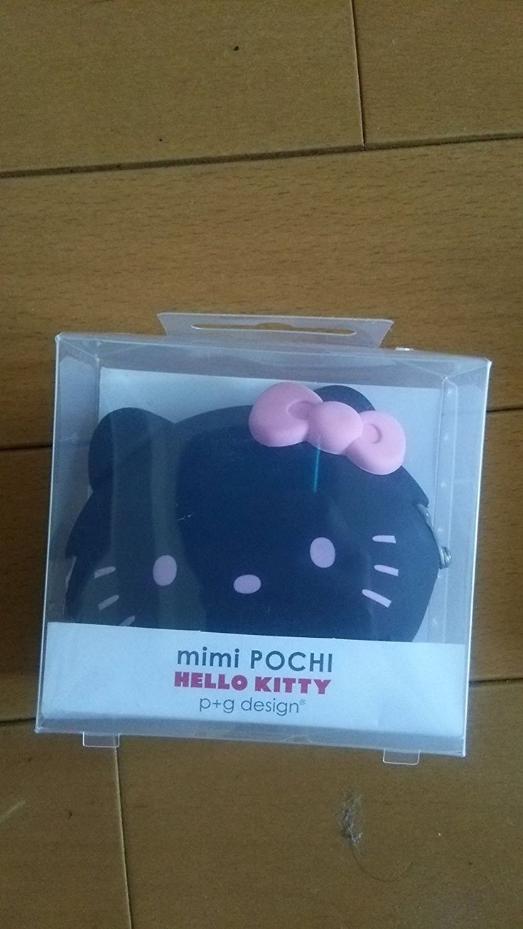 a hello kitty cake in a box on the floor