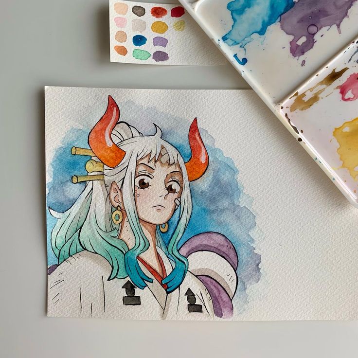 a watercolor painting of a girl with horns on her head, next to some paintbrushes