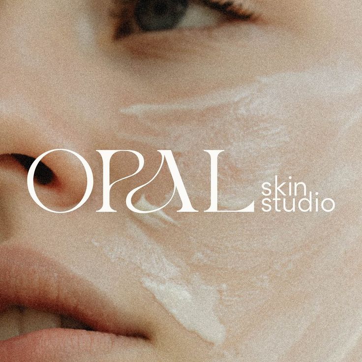 an advertisement for opal skin studio with a woman's face and the word opal on it