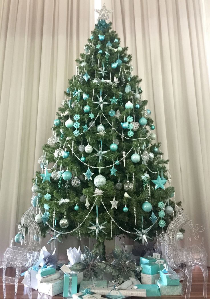 a christmas tree with blue and white ornaments