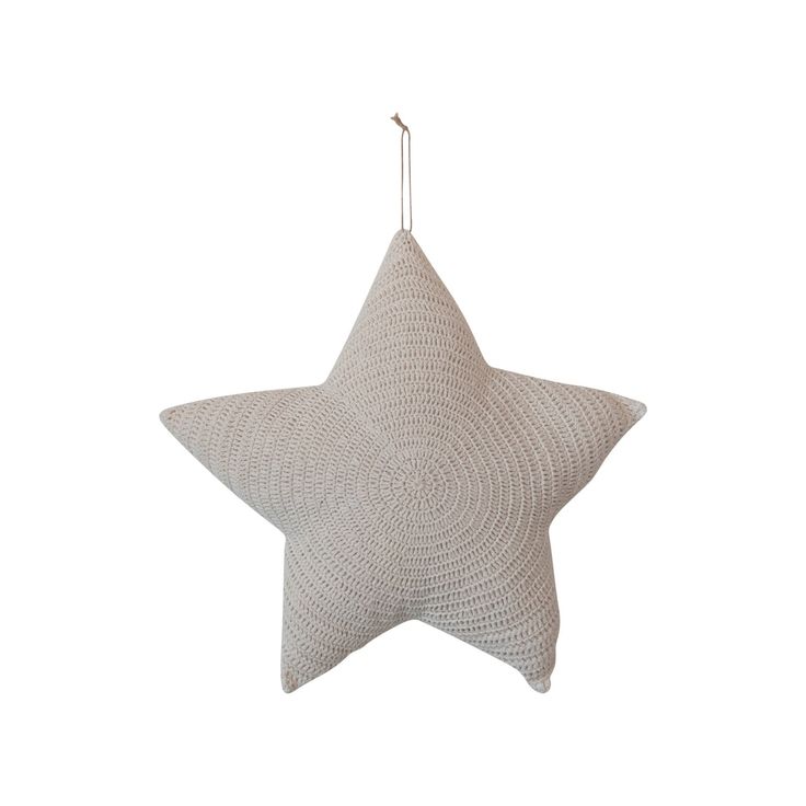 a white star ornament hanging from the ceiling