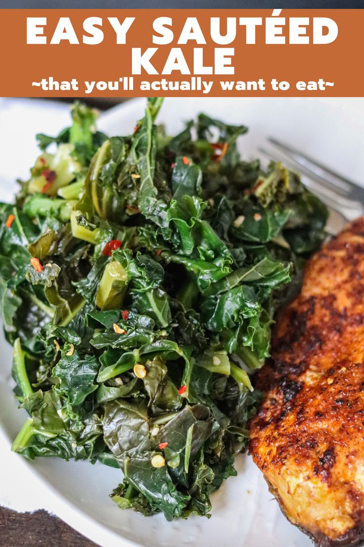 a white plate topped with greens and chicken next to a fork on top of a table