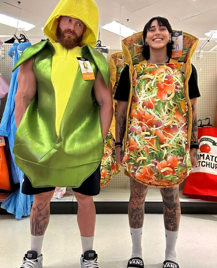 two people in costumes standing next to each other