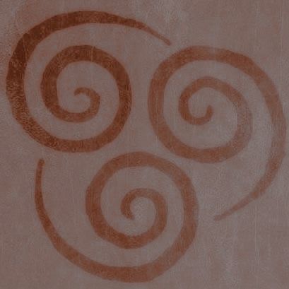 a brown and white drawing on the side of a wall with swirls in it