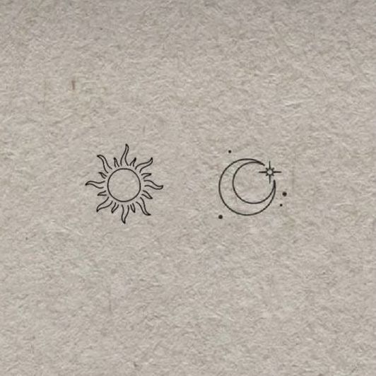 the sun and moon are drawn on paper