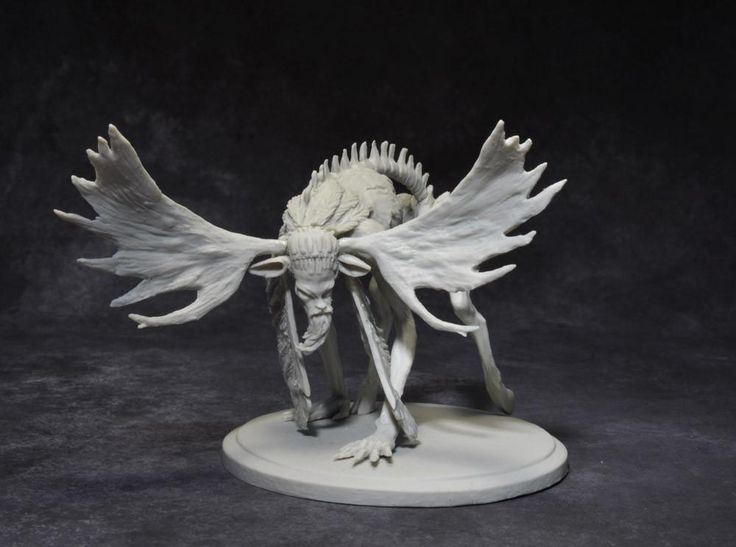 a white model of a creature with large wings