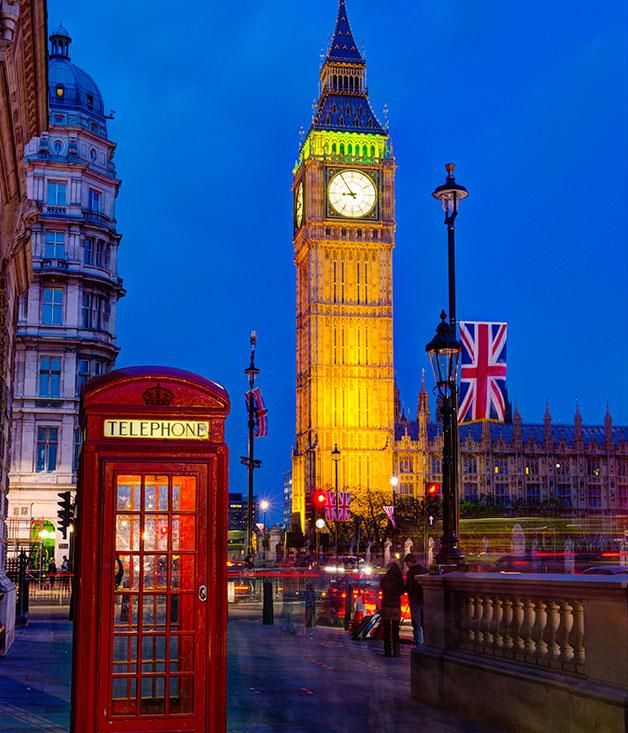 the big ben clock tower towering over the city of london, england at night time