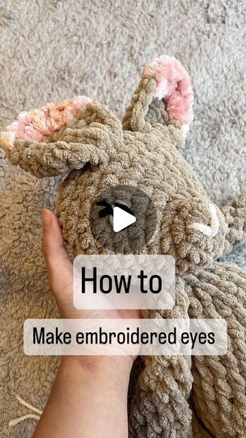 someone holding a stuffed animal with the words how to make embroidered eyes