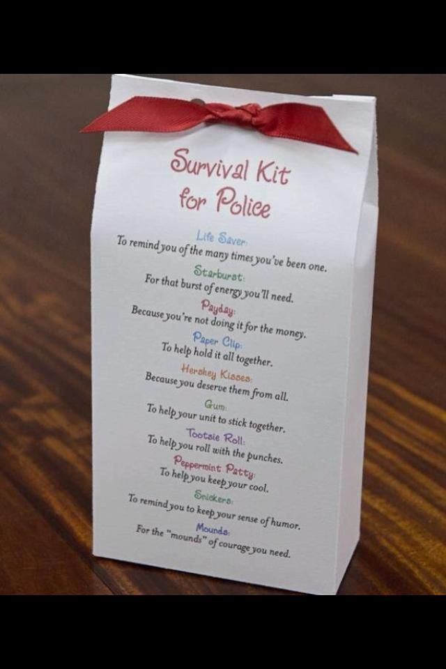 a survival kit for healthcare caregivers on a wooden table with a red ribbon