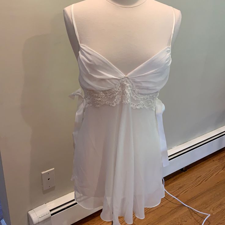 White Chiffon And Lace Night Gown With Satin Bows In Side And Matching Satin Bottoms. Never Worn. Excellent Condition. True To Size Large. Measurements: Side Seam To Side Seam: 15 Inches Shoulders To Hem: 31 Inches Coquette Night Dress, White Sheer Nightgown, White Coquette Nightgown For Wedding Night, Sheer Sleepwear For Wedding Night, White Sheer Sleep Chemise, White V-neck Coquette Sleepwear, White Sheer Chemise For Sleep, White Coquette Nightgown For Sleep, Sheer White Sleepwear