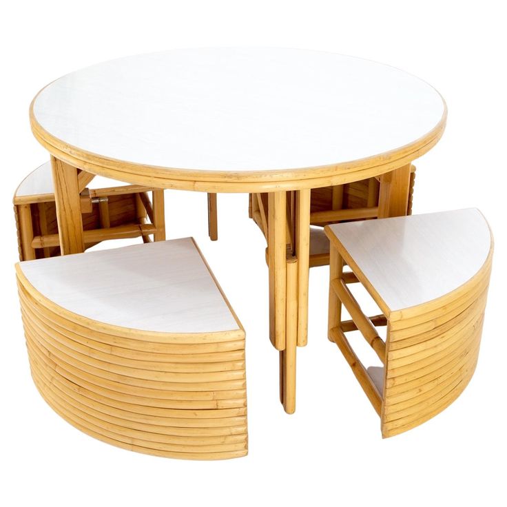 a round table with four chairs and one bench on the bottom is made out of bamboo