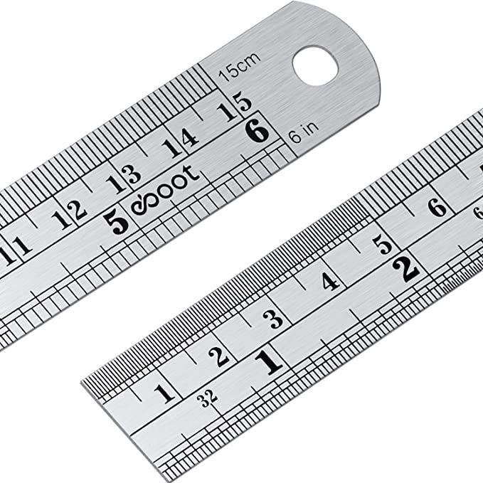 two metal rulers with numbers on them