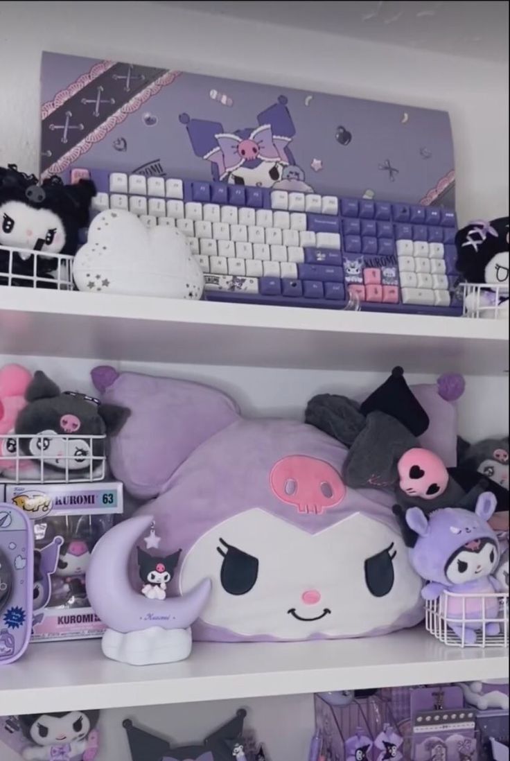 the shelves are filled with stuffed animals and other items in front of a computer keyboard