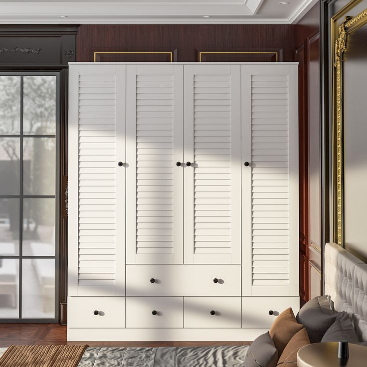 a large white closet in the corner of a room next to a couch and chair